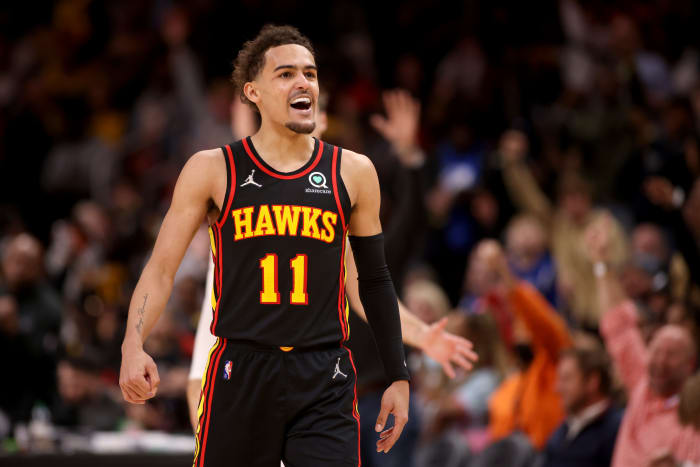 Mar 11, 2022; Atlanta, Georgia, USA; Atlanta Hawks guard Trae Young (11) reacts to a basket by Kevin Huerter (not pictured) during the second half against the LA Clippers at State Farm Arena.